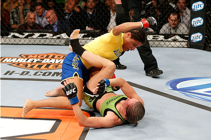 LAS VEGAS, NV - NOVEMBER 30: (L-R) Julianna Pena punches Jessica Rakoczy in their women's bantamweight final fight during The Ultimate Fighter season 18 live finale inside the Mandalay Bay Events Center on November 30, 2013 in Las Vegas, Nevada. (Photo b