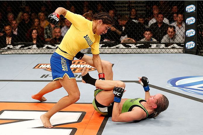 LAS VEGAS, NV - NOVEMBER 30: (L-R) Julianna Pena punches Jessica Rakoczy in their women's bantamweight final fight during The Ultimate Fighter season 18 live finale inside the Mandalay Bay Events Center on November 30, 2013 in Las Vegas, Nevada. (Photo b