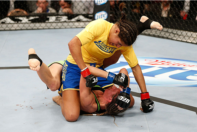 LAS VEGAS, NV - NOVEMBER 30:  (L-R) Julianna Pena controls Jessica Rakoczy in their women's bantamweight final fight during The Ultimate Fighter season 18 live finale inside the Mandalay Bay Events Center on November 30, 2013 in Las Vegas, Nevada. (Photo 