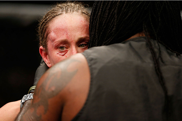 LAS VEGAS, NV - NOVEMBER 30:  Jessica Rakoczy is consoled by her corner after being defeated by Julianna Pena in their women's bantamweight final fight during The Ultimate Fighter season 18 live finale inside the Mandalay Bay Events Center on November 30,