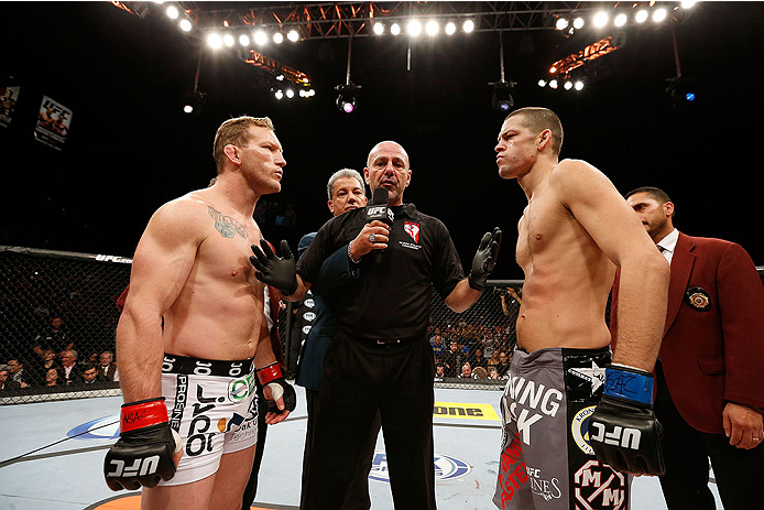 LAS VEGAS, NV - NOVEMBER 30:  (L-R) Gray Maynard and Nate Diaz meet at the center of the Octagon before their lightweight fight during The Ultimate Fighter season 18 live finale inside the Mandalay Bay Events Center on November 30, 2013 in Las Vegas, Neva