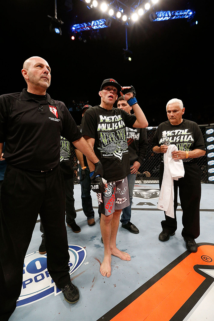 LAS VEGAS, NV - NOVEMBER 30: Nate Diaz celebrates after knocking out Gray Maynard in their lightweight fight during The Ultimate Fighter season 18 live finale inside the Mandalay Bay Events Center on November 30, 2013 in Las Vegas, Nevada. (Photo by Josh
