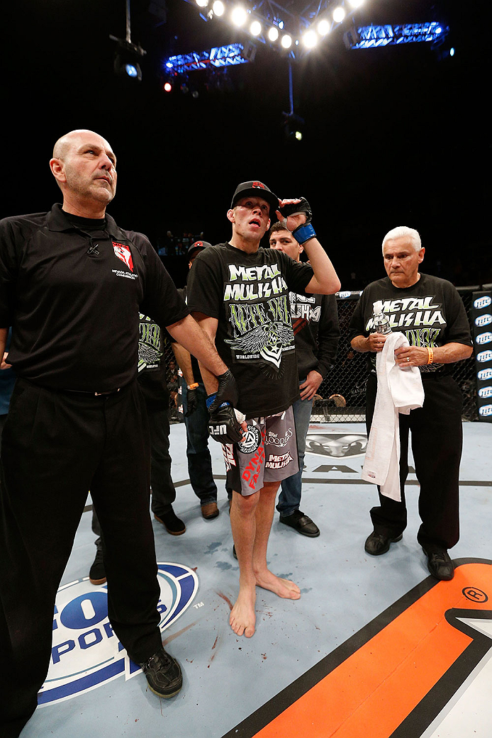 LAS VEGAS, NV - NOVEMBER 30:  Nate Diaz celebrates after knocking out Gray Maynard in their lightweight fight during The Ultimate Fighter season 18 live finale inside the Mandalay Bay Events Center on November 30, 2013 in Las Vegas, Nevada. (Photo by Josh