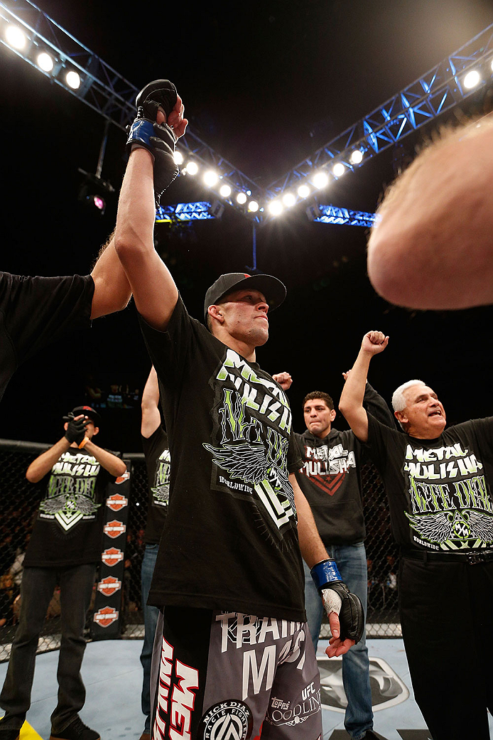 LAS VEGAS, NV - NOVEMBER 30:  Nate Diaz celebrates after knocking out Gray Maynard in their lightweight fight during The Ultimate Fighter season 18 live finale inside the Mandalay Bay Events Center on November 30, 2013 in Las Vegas, Nevada. (Photo by Josh