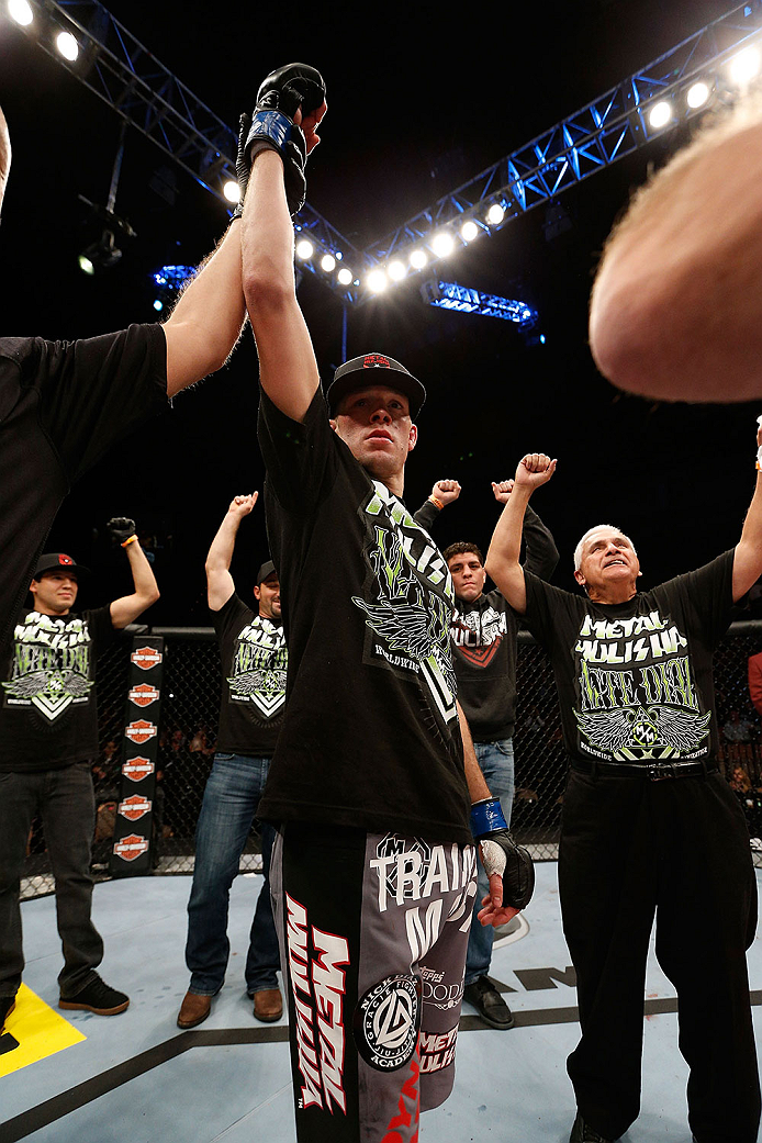 LAS VEGAS, NV - NOVEMBER 30:  Nate Diaz celebrates after knocking out Gray Maynard in their lightweight fight during The Ultimate Fighter season 18 live finale inside the Mandalay Bay Events Center on November 30, 2013 in Las Vegas, Nevada. (Photo by Josh