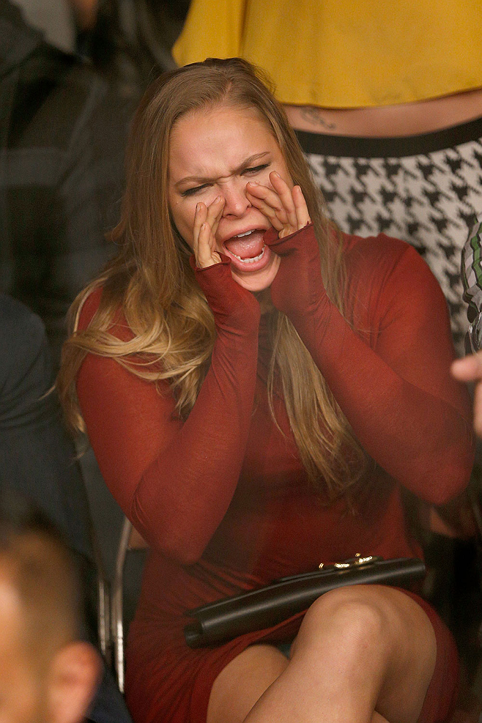 LAS VEGAS, NV - NOVEMBER 30: UFC Women's Bantamweight Champion Ronda Rousey yells from the stands as Gray Maynard and Nate Diaz fight in their lightweight fight during The Ultimate Fighter season 18 live finale inside the Mandalay Bay Events Center on No