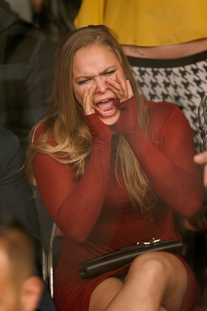 LAS VEGAS, NV - NOVEMBER 30:  UFC Women's Bantamweight Champion Ronda Rousey yells from the stands as Gray Maynard and Nate Diaz fight in their lightweight fight during The Ultimate Fighter season 18 live finale inside the Mandalay Bay Events Center on No