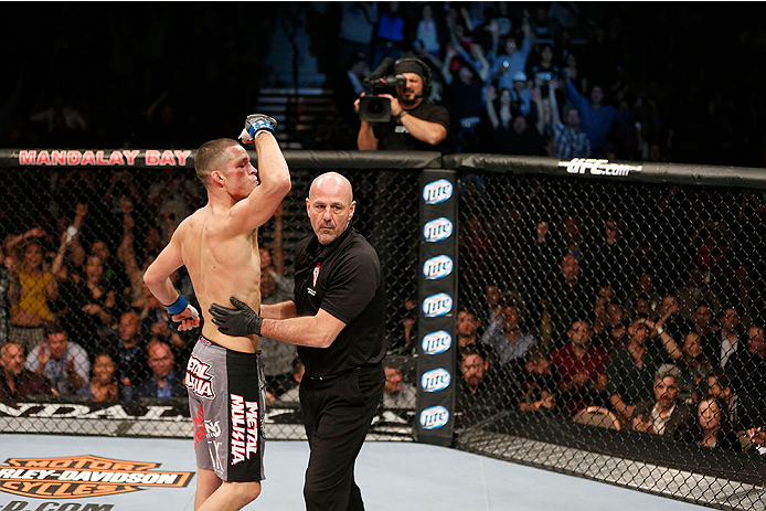 LAS VEGAS, NV - NOVEMBER 30: (L-R) Nate Diaz is called off by referee Yves Lavigne after knocking out Gray Maynard in their lightweight fight during The Ultimate Fighter season 18 live finale inside the Mandalay Bay Events Center on November 30, 2013 in