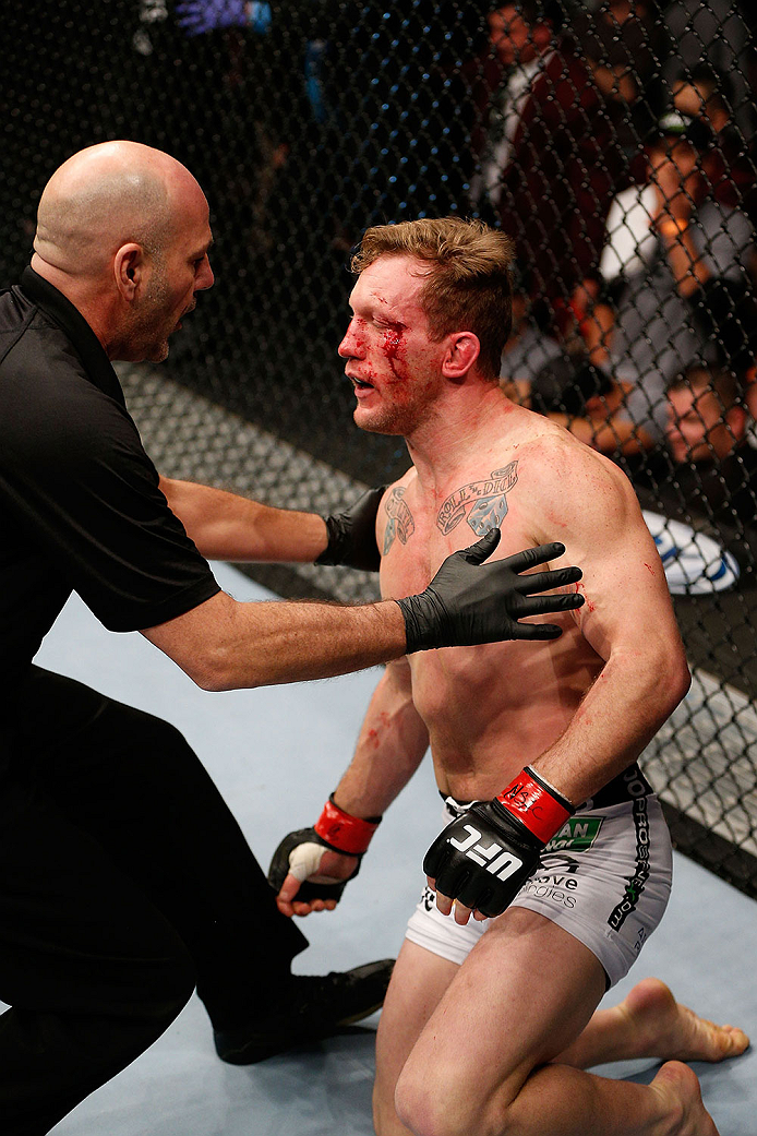 LAS VEGAS, NV - NOVEMBER 30:  (R-L) Gray Maynard is talked to by referee Yves Lavigne after Maynard was knocked out by Diaz in their lightweight fight during The Ultimate Fighter season 18 live finale inside the Mandalay Bay Events Center on November 30, 