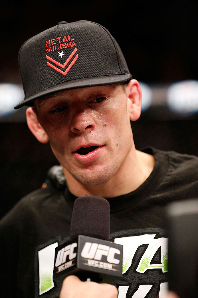 LAS VEGAS, NV - NOVEMBER 30: Nate Diaz celebrates after knocking out Gray Maynard in their lightweight fight during The Ultimate Fighter season 18 live finale inside the Mandalay Bay Events Center on November 30, 2013 in Las Vegas, Nevada. (Photo by Josh