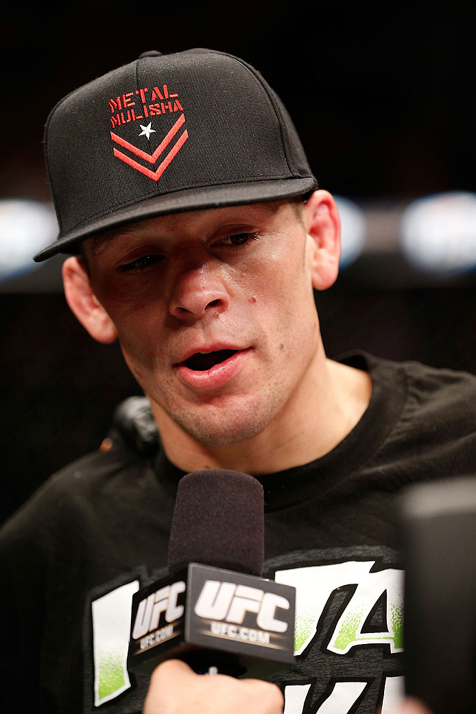 LAS VEGAS, NV - NOVEMBER 30:  Nate Diaz celebrates after knocking out Gray Maynard in their lightweight fight during The Ultimate Fighter season 18 live finale inside the Mandalay Bay Events Center on November 30, 2013 in Las Vegas, Nevada. (Photo by Josh