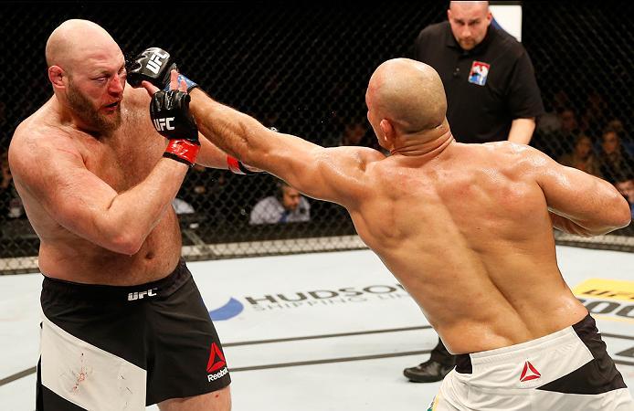 ZAGREB, CROATIA - APRIL 10:   (R-L) Junior Dos Santos punches Ben Rothwell in their heavyweight bout during the UFC Fight Night event at the Arena Zagreb on April 10, 2016 in Zagreb, Croatia. (Photo by Srdjan Stevanovic/Zuffa LLC/Zuffa LLC via Getty Image