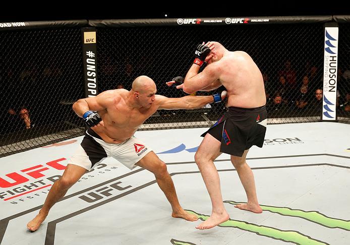 ZAGREB, CROATIA - APRIL 10:   (L-R) Junior Dos Santos punches Ben Rothwell in their heavyweight bout during the UFC Fight Night event at the Arena Zagreb on April 10, 2016 in Zagreb, Croatia. (Photo by Srdjan Stevanovic/Zuffa LLC/Zuffa LLC via Getty Image