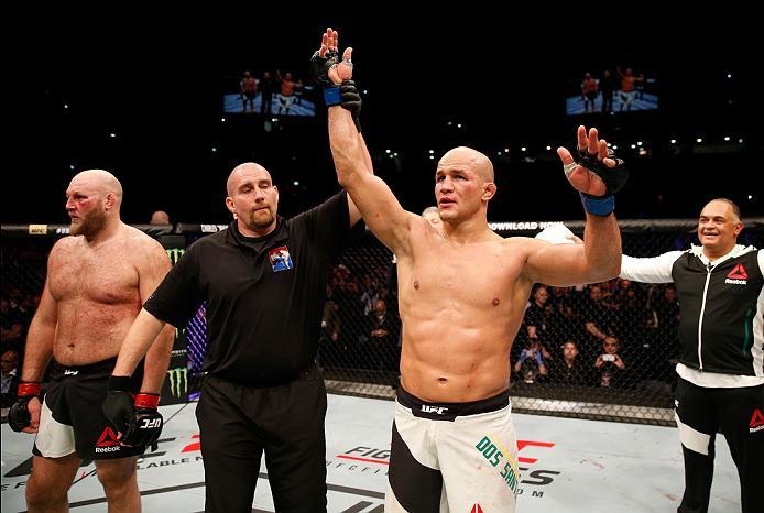 ZAGREB, CROATIA - APRIL 10:   (R-L) Junior Dos Santos celebrates his victory over Ben Rothwell in their heavyweight bout during the UFC Fight Night event at the Arena Zagreb on April 10, 2016 in Zagreb, Croatia. (Photo by Srdjan Stevanovic/Zuffa LLC/Zuffa