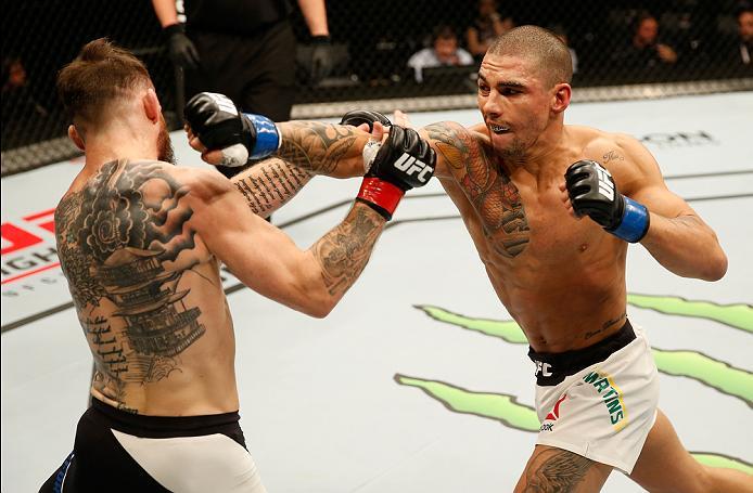 ZAGREB, CROATIA - APRIL 10:   (R-L) Lucas Martins punches Rob Whiteford in their featherweight bout during the UFC Fight Night event at the Arena Zagreb on April 10, 2016 in Zagreb, Croatia. (Photo by Srdjan Stevanovic/Zuffa LLC/Zuffa LLC via Getty Images