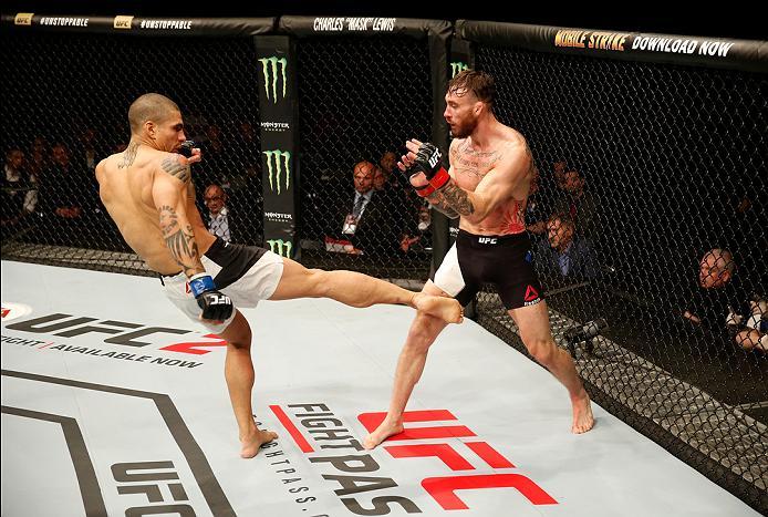 ZAGREB, CROATIA - APRIL 10:   (L-R) Lucas Martins kicks Rob Whiteford in their featherweight bout during the UFC Fight Night event at the Arena Zagreb on April 10, 2016 in Zagreb, Croatia. (Photo by Srdjan Stevanovic/Zuffa LLC/Zuffa LLC via Getty Images)