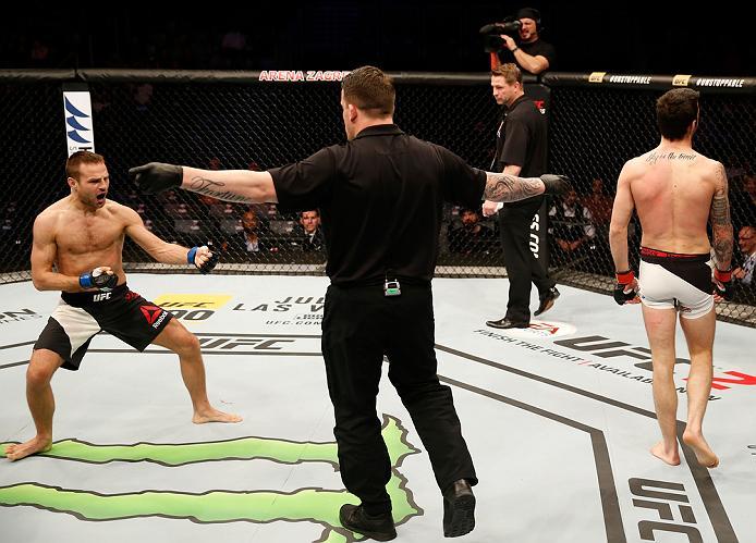 ZAGREB, CROATIA - APRIL 10:   (L-R) Damian Stasiakin celebrates his submission victory over Filip Pejic in their bantamweight bout during the UFC Fight Night event at the Arena Zagreb on April 10, 2016 in Zagreb, Croatia. (Photo by Srdjan Stevanovic/Zuffa