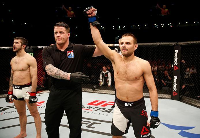 ZAGREB, CROATIA - APRIL 10:   (R-L) Damian Stasiakin celebrates his submission victory over Filip Pejic in their bantamweight bout during the UFC Fight Night event at the Arena Zagreb on April 10, 2016 in Zagreb, Croatia. (Photo by Srdjan Stevanovic/Zuffa