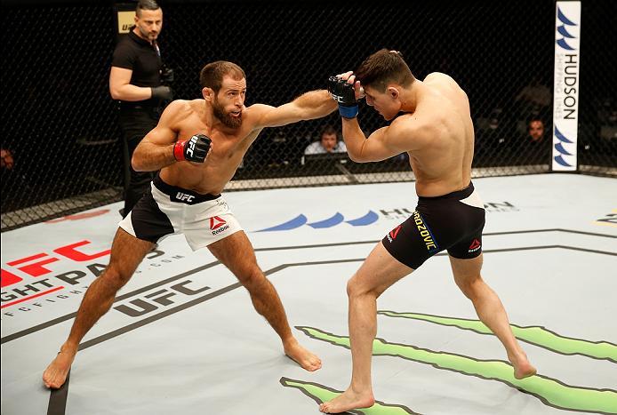 ZAGREB, CROATIA - APRIL 10:   (L-R) Mairbek Taisumov punches Damir Hadzovic in their lightweight bout during the UFC Fight Night event at the Arena Zagreb on April 10, 2016 in Zagreb, Croatia. (Photo by Srdjan Stevanovic/Zuffa LLC/Zuffa LLC via Getty Imag
