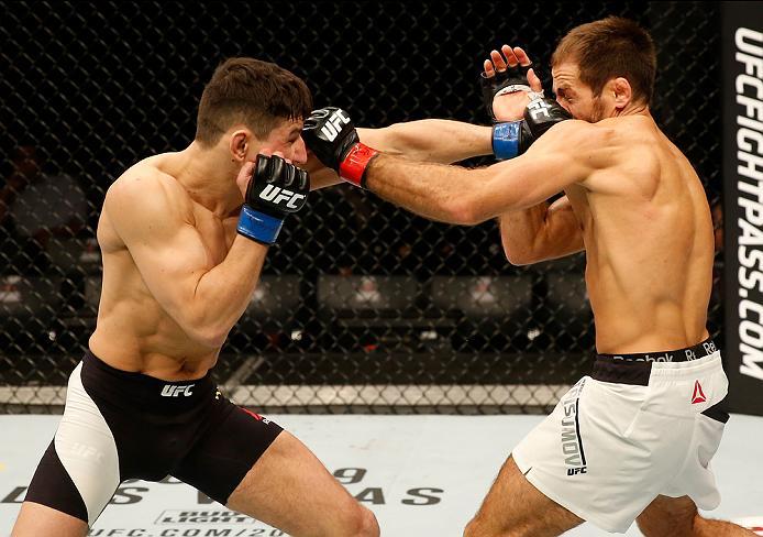 ZAGREB, CROATIA - APRIL 10:   (L-R) Damir Hadzovic punches Mairbek Taisumov in their lightweight bout during the UFC Fight Night event at the Arena Zagreb on April 10, 2016 in Zagreb, Croatia. (Photo by Srdjan Stevanovic/Zuffa LLC/Zuffa LLC via Getty Imag