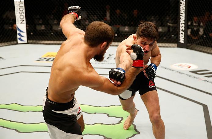 ZAGREB, CROATIA - APRIL 10:   (R-L) Damir Hadzovic punches Mairbek Taisumov in their lightweight bout during the UFC Fight Night event at the Arena Zagreb on April 10, 2016 in Zagreb, Croatia. (Photo by Srdjan Stevanovic/Zuffa LLC/Zuffa LLC via Getty Imag