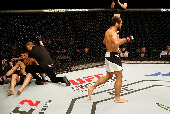 ZAGREB, CROATIA - APRIL 10:   (R-L) Mairbek Taisumov celebrates his knockout victory over Damir Hadzovic in their lightweight bout during the UFC Fight Night event at the Arena Zagreb on April 10, 2016 in Zagreb, Croatia. (Photo by Srdjan Stevanovic/Zuffa