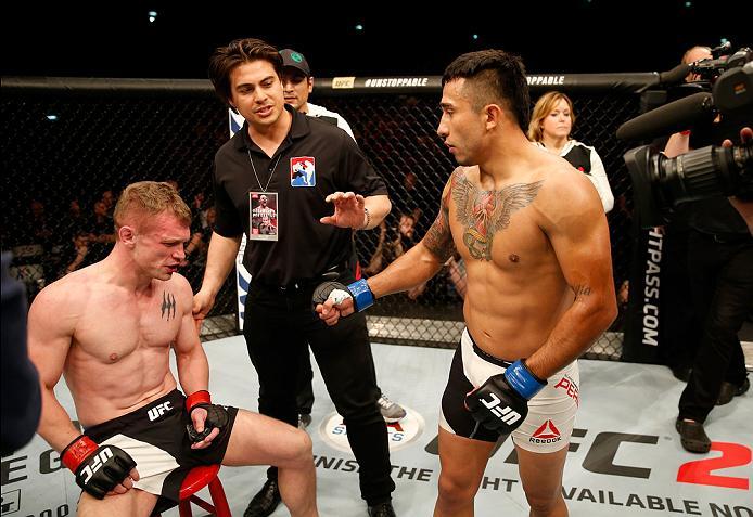 ZAGREB, CROATIA - APRIL 10:   (R-L) Alejandro Perez checks on Ian Entwistle after their bantamweight bout during the UFC Fight Night event at the Arena Zagreb on April 10, 2016 in Zagreb, Croatia. (Photo by Srdjan Stevanovic/Zuffa LLC/Zuffa LLC via Getty 