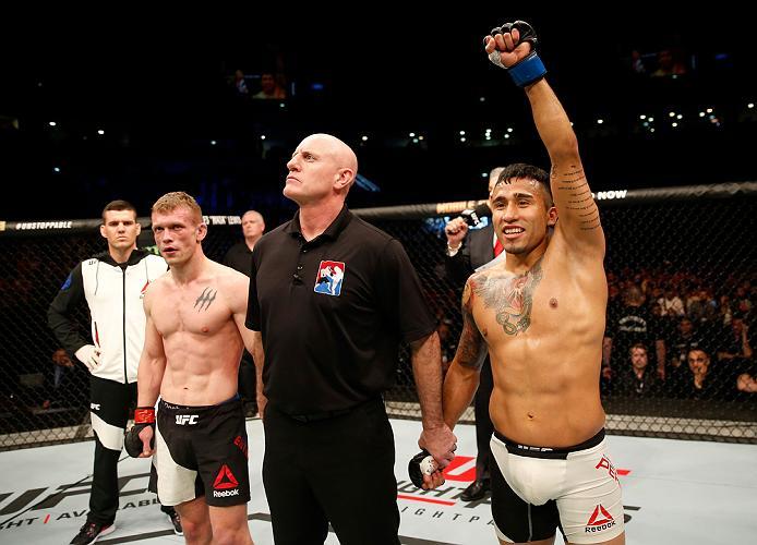 ZAGREB, CROATIA - APRIL 10:   (R-L) Alejandro Perez celebrates his victory over Ian Entwistle in their bantamweight bout during the UFC Fight Night event at the Arena Zagreb on April 10, 2016 in Zagreb, Croatia. (Photo by Srdjan Stevanovic/Zuffa LLC/Zuffa