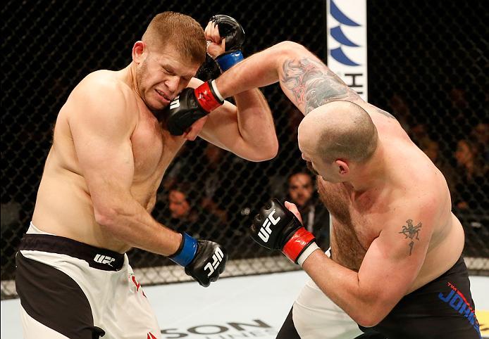 ZAGREB, CROATIA - APRIL 10:   (R-L) Timothy Johnson punches Marcin Tybura in their heavyweight bout during the UFC Fight Night event at the Arena Zagreb on April 10, 2016 in Zagreb, Croatia. (Photo by Srdjan Stevanovic/Zuffa LLC/Zuffa LLC via Getty Images