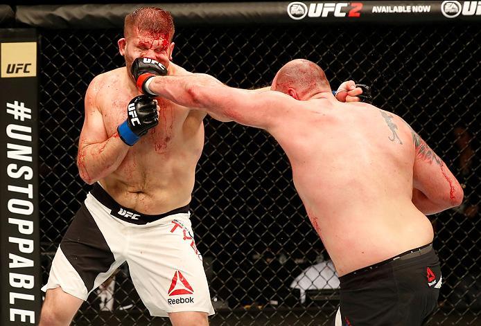 ZAGREB, CROATIA - APRIL 10:   (R-L) Timothy Johnson punches Marcin Tybura in their heavyweight bout during the UFC Fight Night event at the Arena Zagreb on April 10, 2016 in Zagreb, Croatia. (Photo by Srdjan Stevanovic/Zuffa LLC/Zuffa LLC via Getty Images
