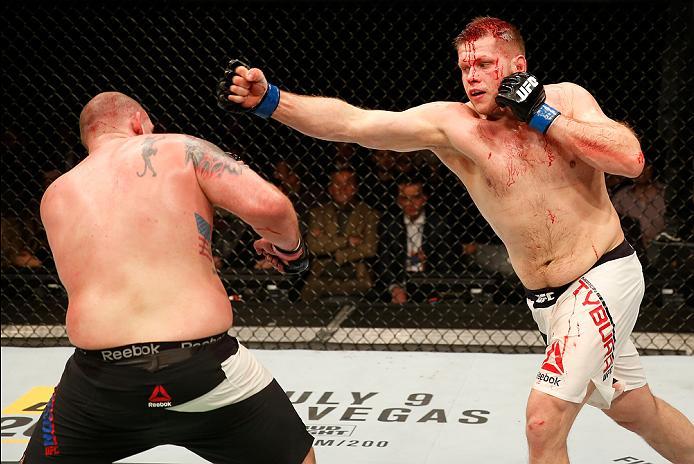 ZAGREB, CROATIA - APRIL 10:   (R-L) Marcin Tybura punches Timothy Johnson in their heavyweight bout during the UFC Fight Night event at the Arena Zagreb on April 10, 2016 in Zagreb, Croatia. (Photo by Srdjan Stevanovic/Zuffa LLC/Zuffa LLC via Getty Images