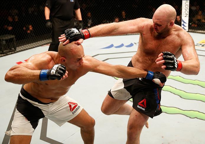 ZAGREB, CROATIA - APRIL 10:   (L-R) Junior Dos Santos punches Ben Rothwell in their heavyweight bout during the UFC Fight Night event at the Arena Zagreb on April 10, 2016 in Zagreb, Croatia. (Photo by Srdjan Stevanovic/Zuffa LLC/Zuffa LLC via Getty Image