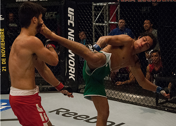 LAS VEGAS, NV - MARCH 27: (R-L) Danny Salas kicks Horacio Gutierrez during the filming of The Ultimate Fighter Latin America: Team Gastelum vs Team Escudero on March 27, 2015 in Las Vegas, Nevada. (Photo by Brandon Magnus/Zuffa LLC/Zuffa LLC via Getty I