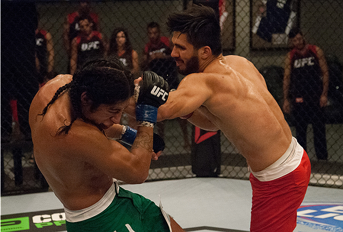 LAS VEGAS, NV - MARCH 27:  (R-L) Horacio Gutierrez punches Danny Salas during the filming of The Ultimate Fighter Latin America: Team Gastelum vs Team Escudero  on March 27, 2015 in Las Vegas, Nevada. (Photo by Brandon Magnus/Zuffa LLC/Zuffa LLC via Getty