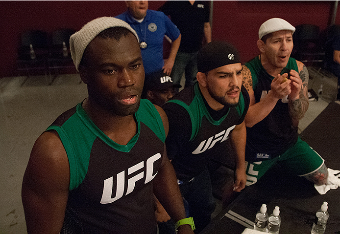 LAS VEGAS, NV - MARCH 27: Coaches Uriah Hall and Kelvin Gastelum yell as Danny Salas fights Horacio Gutierrez during the filming of The Ultimate Fighter Latin America: Team Gastelum vs Team Escudero on March 27, 2015 in Las Vegas, Nevada. (Photo by Bran