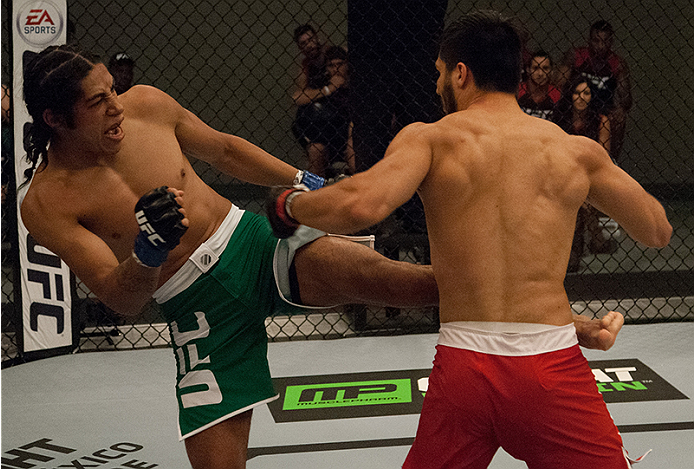 LAS VEGAS, NV - MARCH 27: (L-R) Danny Salas kicks Horacio Gutierrez during the filming of The Ultimate Fighter Latin America: Team Gastelum vs Team Escudero on March 27, 2015 in Las Vegas, Nevada. (Photo by Brandon Magnus/Zuffa LLC/Zuffa LLC via Getty I
