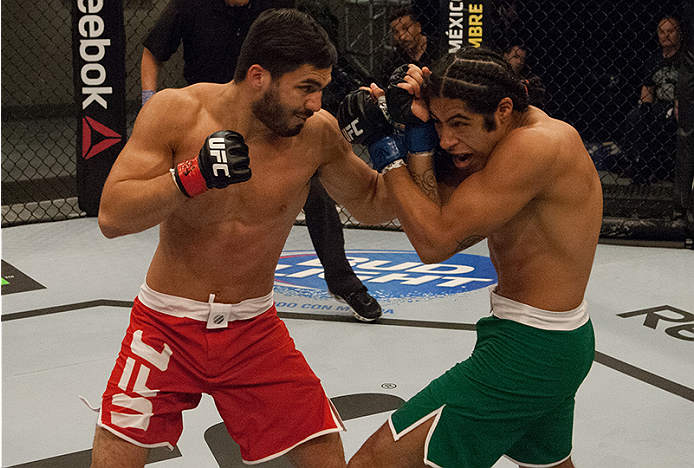 LAS VEGAS, NV - MARCH 27: (L-R) Horacio Gutierrez punches Danny Salas during the filming of The Ultimate Fighter Latin America: Team Gastelum vs Team Escudero on March 27, 2015 in Las Vegas, Nevada. (Photo by Brandon Magnus/Zuffa LLC/Zuffa LLC via Getty