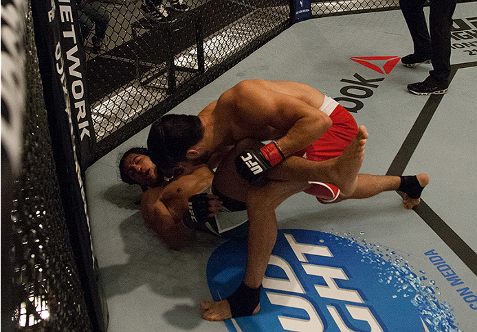 LAS VEGAS, NV - MARCH 27: Horacio Gutierrez (top) punches Danny Salas during the filming of The Ultimate Fighter Latin America: Team Gastelum vs Team Escudero on March 27, 2015 in Las Vegas, Nevada. (Photo by Brandon Magnus/Zuffa LLC/Zuffa LLC via Getty