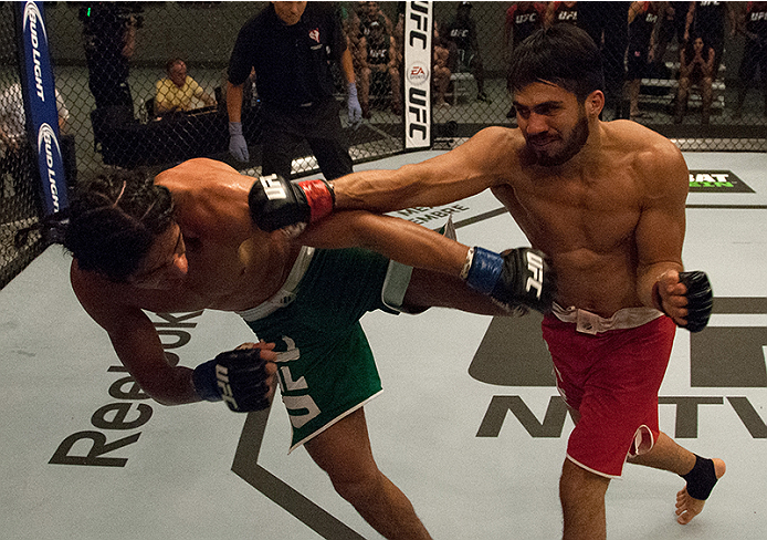 LAS VEGAS, NV - MARCH 27: (R-L) Horacio Gutierrez punches Danny Salas during the filming of The Ultimate Fighter Latin America: Team Gastelum vs Team Escudero on March 27, 2015 in Las Vegas, Nevada. (Photo by Brandon Magnus/Zuffa LLC/Zuffa LLC via Getty