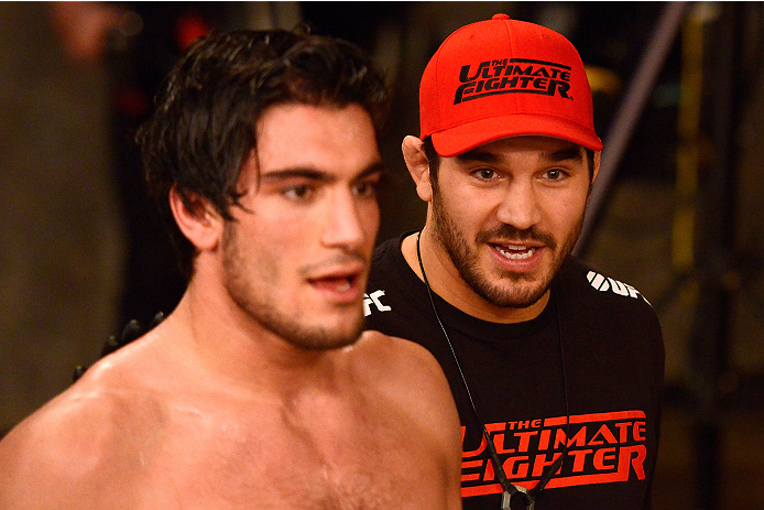 LACHUTE, CANADA - DECEMBER 6:  (R-L) Team Canada Coach Patrick Cote congratulates his fighter Elias Theodorou after defeating Team Australia fighter Tyler Manawaroa in their semifinal middleweight fight during filming of The Ultimate Fighter Nations telev