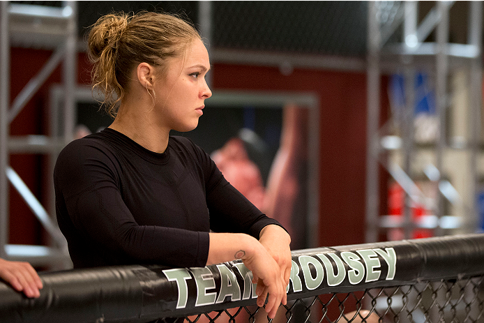 LAS VEGAS, NV - JUNE 21:  Coach Ronda Rousey stands above Peggy Morgan's (not pictured) corner before her preliminary fight against Sarah Moras (not pictured) during filming of season eighteen of The Ultimate Fighter on June 21, 2013 in Las Vegas, Nevada.