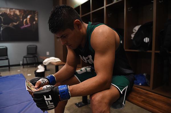 LAS VEGAS, NV - APRIL 21: Hector Aldana sits quietly in the locker room before facing Enrique Marin in the semi-finals during the filming of The Ultimate Fighter Latin America: Team Gastelum vs Team Escudero on April 21, 2015 in Las Vegas, Nevada. (Phot