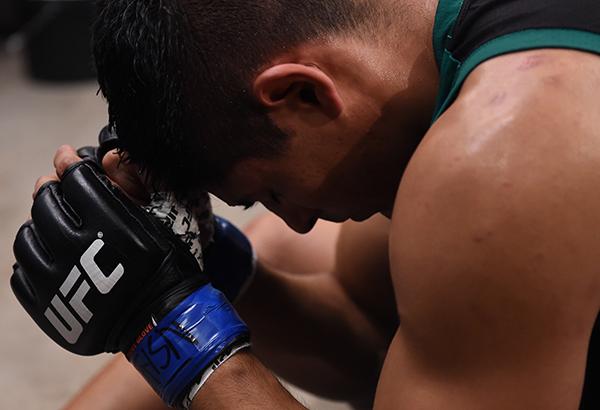 LAS VEGAS, NV - APRIL 21: Hector Aldana sits quietly in the locker room before facing Enrique Marin in the semi-finals during the filming of The Ultimate Fighter Latin America: Team Gastelum vs Team Escudero on April 21, 2015 in Las Vegas, Nevada. (Phot