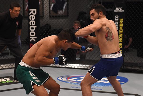 LAS VEGAS, NV - APRIL 21: (R-L) Enrique Marin punches Hector Aldana in the semi-finals during the filming of The Ultimate Fighter Latin America: Team Gastelum vs Team Escudero on April 21, 2015 in Las Vegas, Nevada. (Photo by Brandon Magnus/Zuffa LLC/Zu