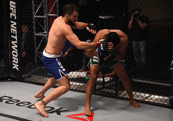 LAS VEGAS, NV - APRIL 21: (L-R) Enrique Marin punches Hector Aldana in the semi-finals during the filming of The Ultimate Fighter Latin America: Team Gastelum vs Team Escudero on April 21, 2015 in Las Vegas, Nevada. (Photo by Brandon Magnus/Zuffa LLC/Zu