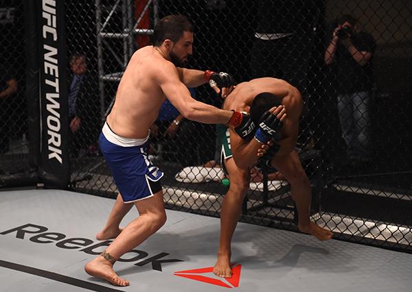 LAS VEGAS, NV - APRIL 21: (L-R) Enrique Marin punches Hector Aldana in the semi-finals during the filming of The Ultimate Fighter Latin America: Team Gastelum vs Team Escudero on April 21, 2015 in Las Vegas, Nevada. (Photo by Brandon Magnus/Zuffa LLC/Zu