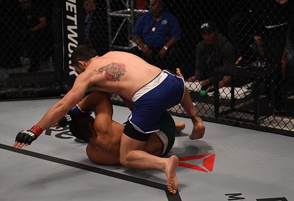 LAS VEGAS, NV - APRIL 21: Enrique Marin (top) punches Hector Aldana in the semi-finals during the filming of The Ultimate Fighter Latin America: Team Gastelum vs Team Escudero on April 21, 2015 in Las Vegas, Nevada. (Photo by Brandon Magnus/Zuffa LLC/Zu