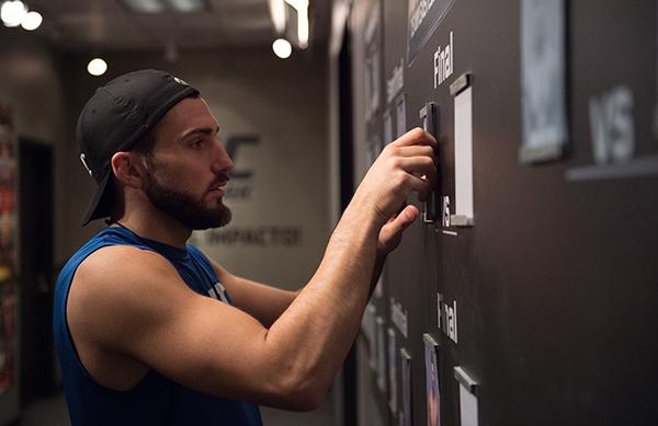 LAS VEGAS, NV - APRIL 21: Enrique Marin moves his name card into the Finals column after defeating Hector Aldana in the semi-finals during the filming of The Ultimate Fighter Latin America: Team Gastelum vs Team Escudero on April 21, 2015 in Las Vegas,