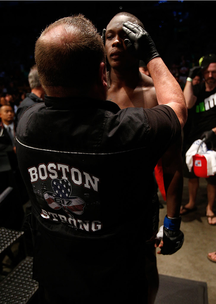 BOSTON, MA - AUGUST 17:  A UFC cutman displays a "Boston Strong" logo on his vest as Ovince Saint Preux prepares to enter the Octagon before his UFC light heavyweight bout against Cody Donovan at TD Garden on August 17, 2013 in Boston, Massachusetts. (Pho