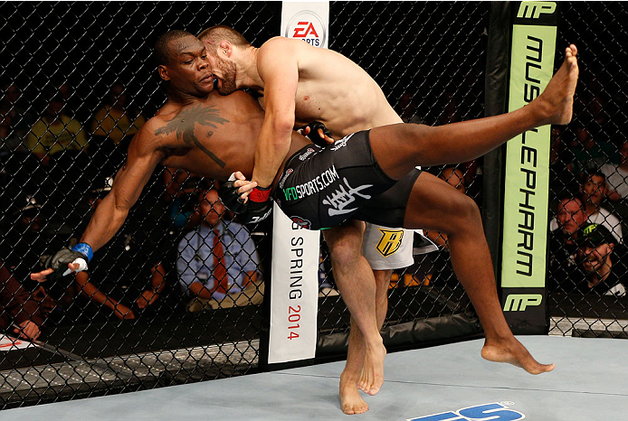 BOSTON, MA - AUGUST 17:  (R-L) Cody Donovan takes down Ovince Saint Preux in their UFC light heavyweight bout at TD Garden on August 17, 2013 in Boston, Massachusetts. (Photo by Josh Hedges/Zuffa LLC/Zuffa LLC via Getty Images)